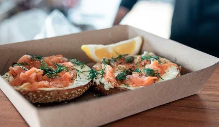 cream cheese and smoked salmon on a bagel.